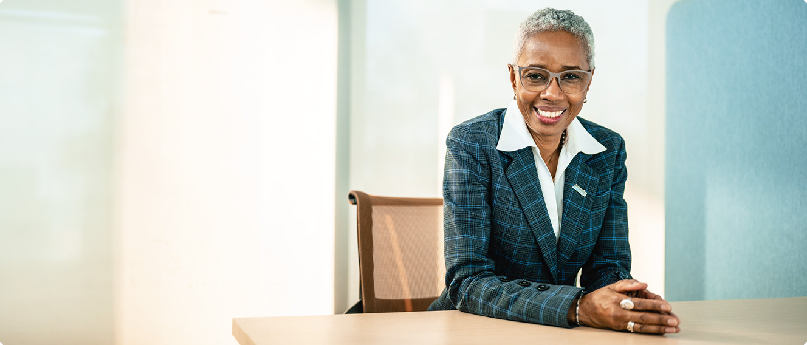 Portrait of a woman sitting at a table