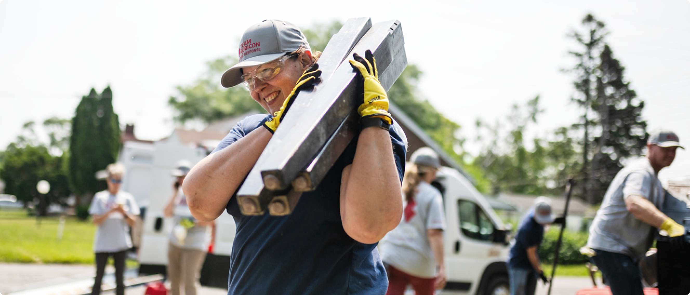 A person carrying building materials