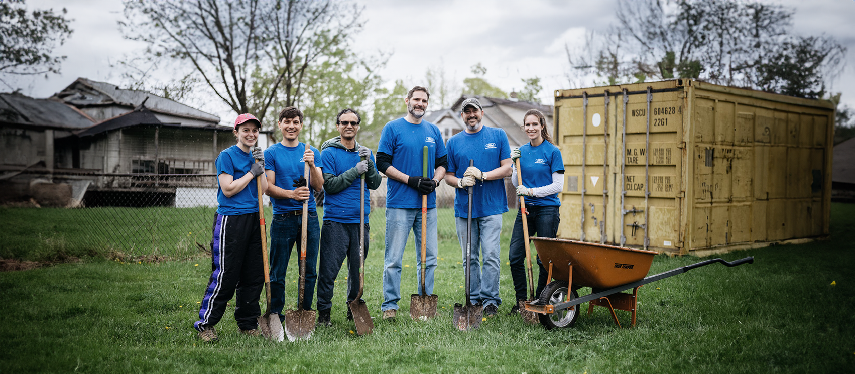 About Us Hero Volunteers with shovels